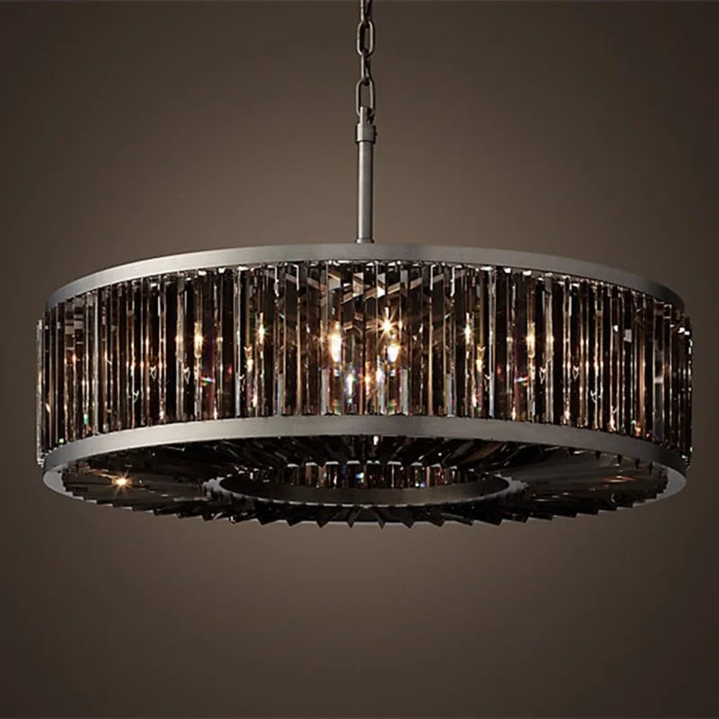 Maison Ornate vintage modern chandelier with dark metal frame, vertical glass panels, and warm glowing crystal accents.