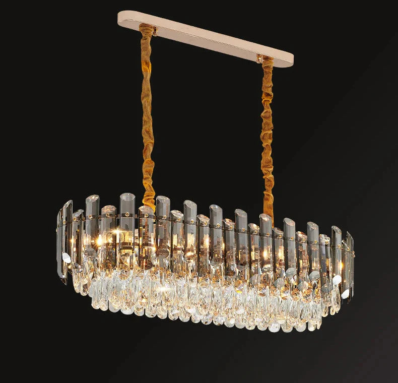 Maison Ornate Elegant Modern Crystal Pendant Light with gold accents and sparkling crystal drops.