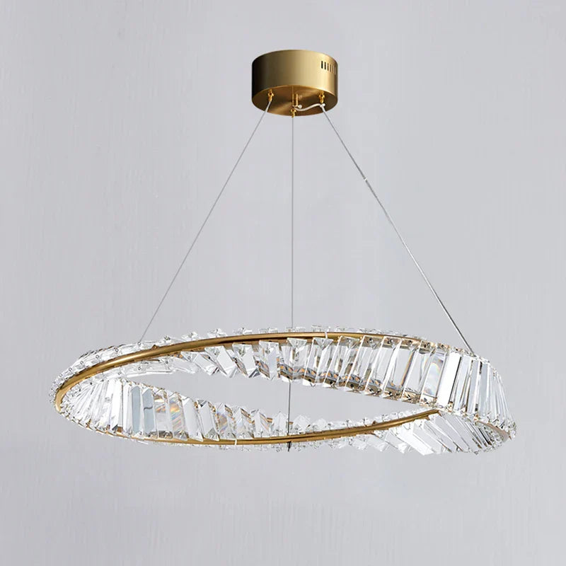 Maison Ornate Modern Chandelier with angular crystals on gold ring, suspended by three wires.