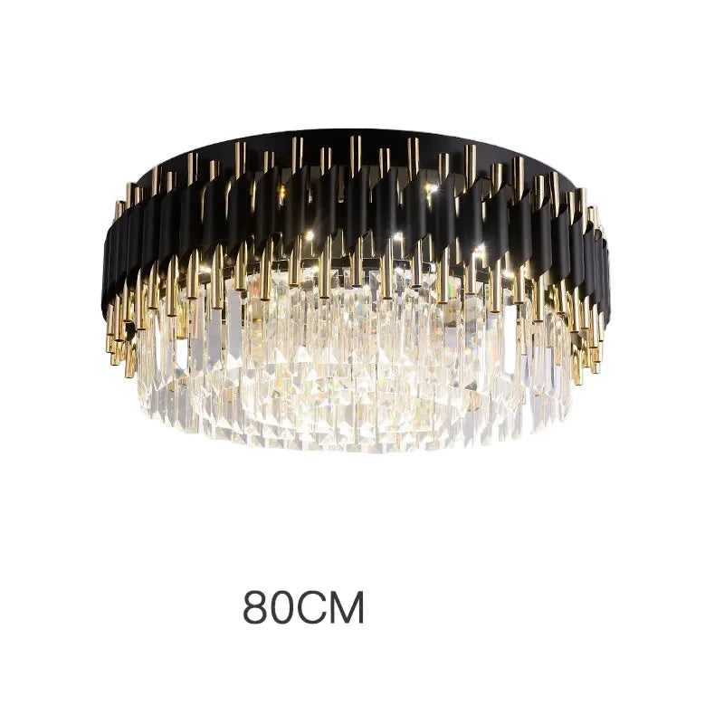Black and gold chandelier with hanging crystal prisms, 80 cm diameter, emits bright decorative light.