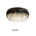 Black and gold chandelier with crystal prisms, 50 cm diameter, elegant modern LED lighting.