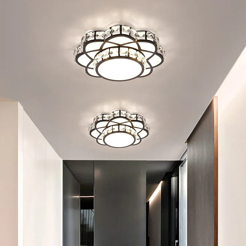 Two Maison Ornate Golden Crystal Floral Decorative LED Chandeliers with metal and glass accents.