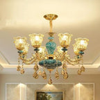 Maison Ornate Baroque chandelier with six glass lamps, gold and turquoise accents, crystal ornaments.