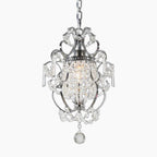 Sparkling crystal chandelier with silver metalwork, chain suspension, and a single decorative tassel.