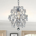 Modern crystal ball chandelier with sparkling beads, diamond accents, and polished silver frame by Maison Ornate.