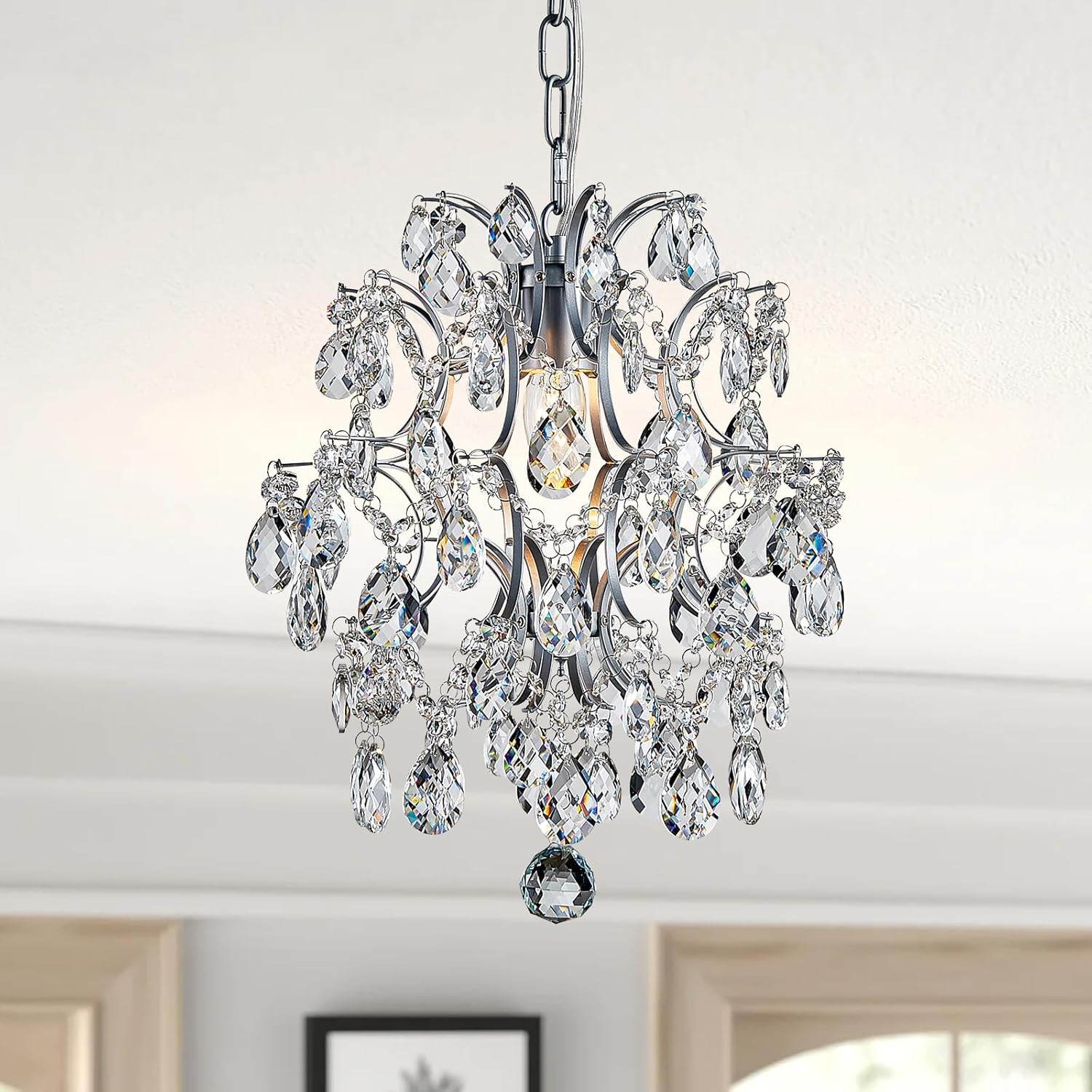 Modern crystal ball chandelier with sparkling beads, diamond accents, and polished silver frame by Maison Ornate.