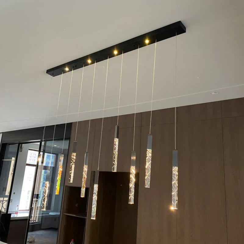 Maison Ornate Modern Crystal Chandelier with chrome frame and crystal pendants, elegantly illuminated.