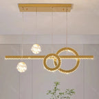 Modern crystal chandelier with three illuminated spheres and intersecting circles for elegant décor.