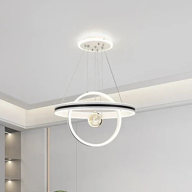Modern circular chandelier with suspended crystal LED rings and adjustable minimalist geometric design.