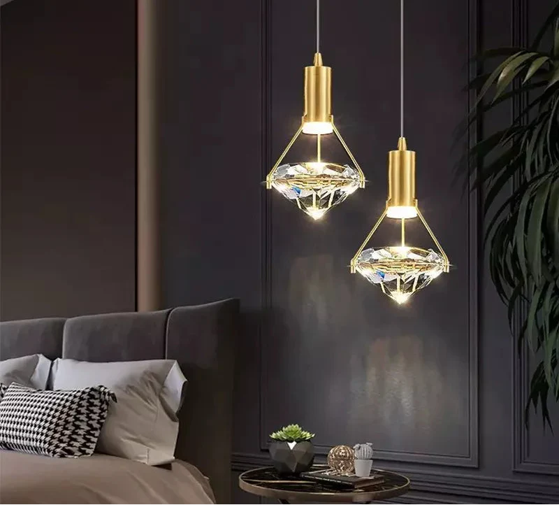 Pair of Maison Modern Nordic Diamond Design crystal pendants with gold fixtures, ornate and elegant.