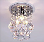 Maison Ornate Modern Crystal Pendant Light with tassels, featuring crystal beads and pendants. Sparkling chandelier design.