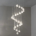 Elegant spiral chandelier with glass crystal spheres and bright LEDs, modern long-shape design.