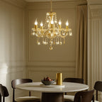 A 5-branch gold LED crystal contemporary chandelier by Maison Ornate, elegant and modern.
