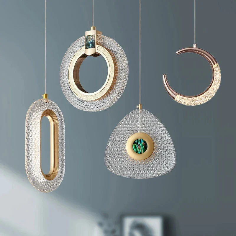 Maison Ornate Art Deco Crystal Chandelier with gold emerald suspension and four geometric-shaped pendant lights.