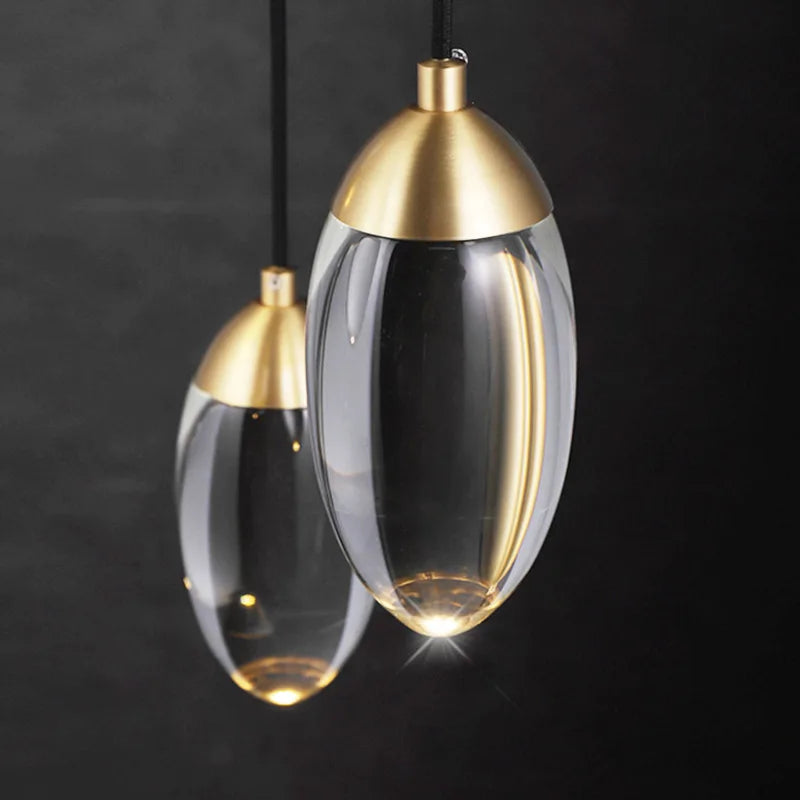 Two luxury crystal industrial chandeliers with copper elements, warm glow, elegant LED-inspired design.