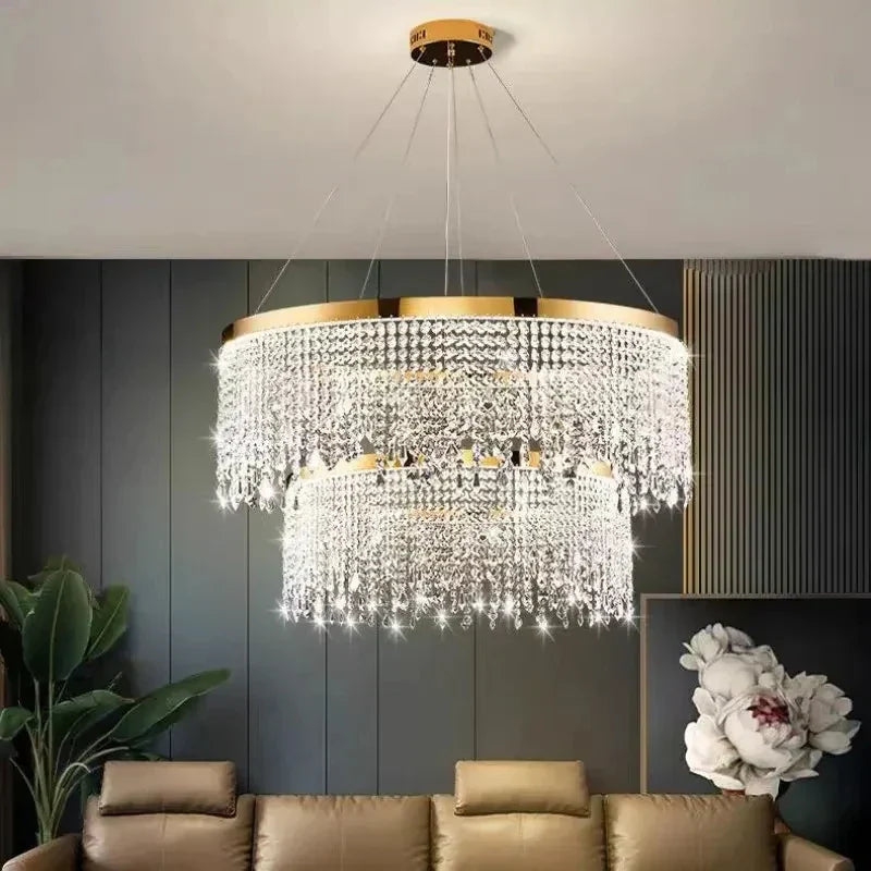 The Maison Ornate Modern Crystal Chandelier features gold round pendants in an elegant, contemporary design.