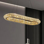 Modern oval crystal LED chandelier with sparkling crystals, suspended by thin wires for elegance.
