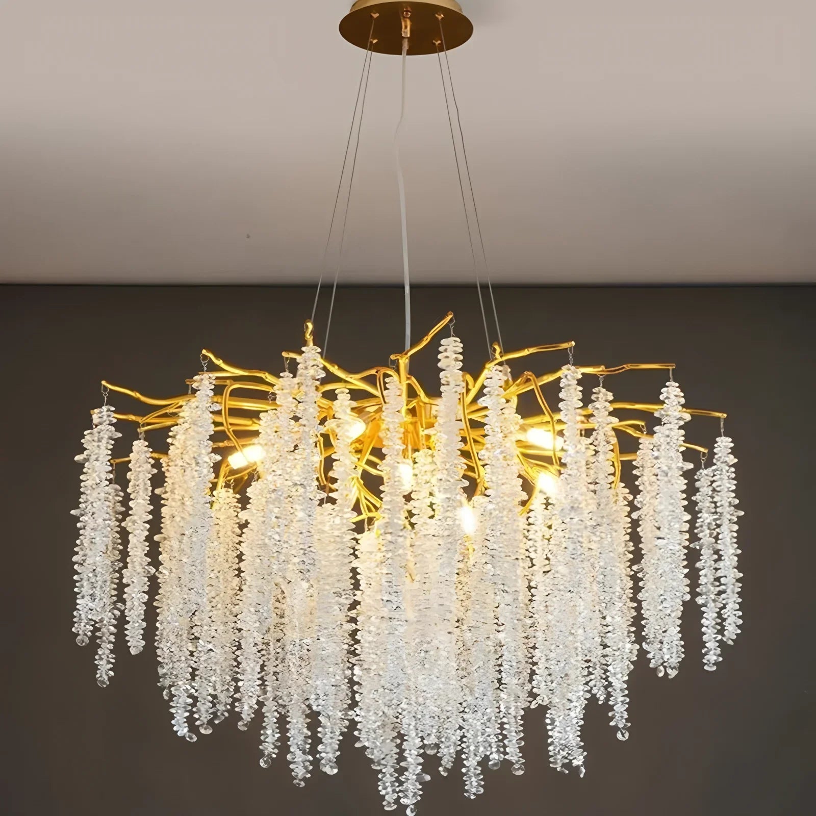 Gold-branch crystal LED chandelier with cascading clear beads, creating a sparkling, elegant overhead accent.