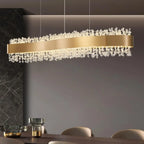 The Maison Ornate Adjustable Modern LED Crystal Chandelier with striking gold accents and intricate crystal details.