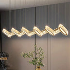 Modern crystal chandelier with zigzag LED geometric segments, gold accents, and elegant architectural design.