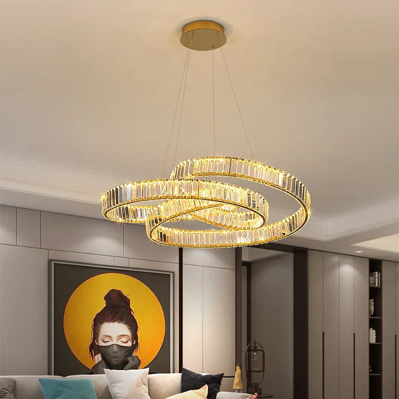 Maison Ornate Nordic Minimalist LED Crystal Industrial Chandelier in gold and crystal, elegantly suspended overhead.