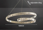 Modern crystal suspension chandelier with LED lights, adjustable wires, and circular black metal frame.