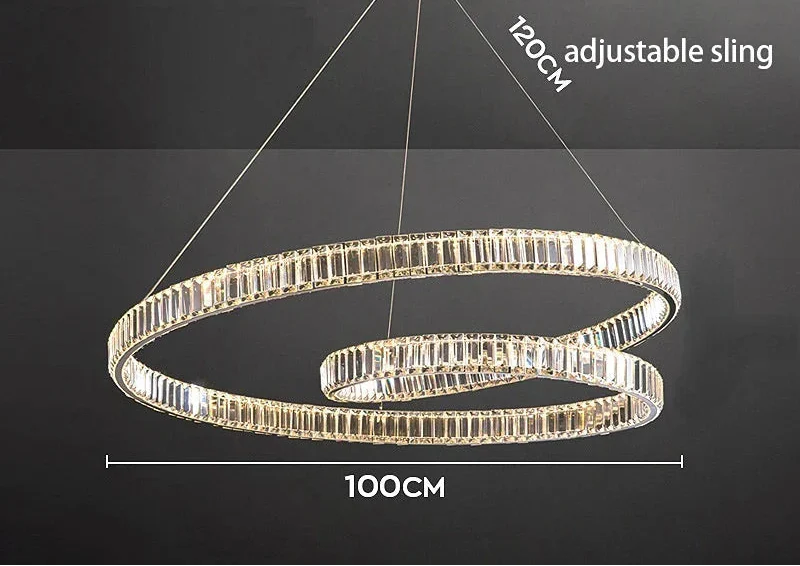 Modern crystal suspension chandelier with LED lights, adjustable wires, and circular black metal frame.