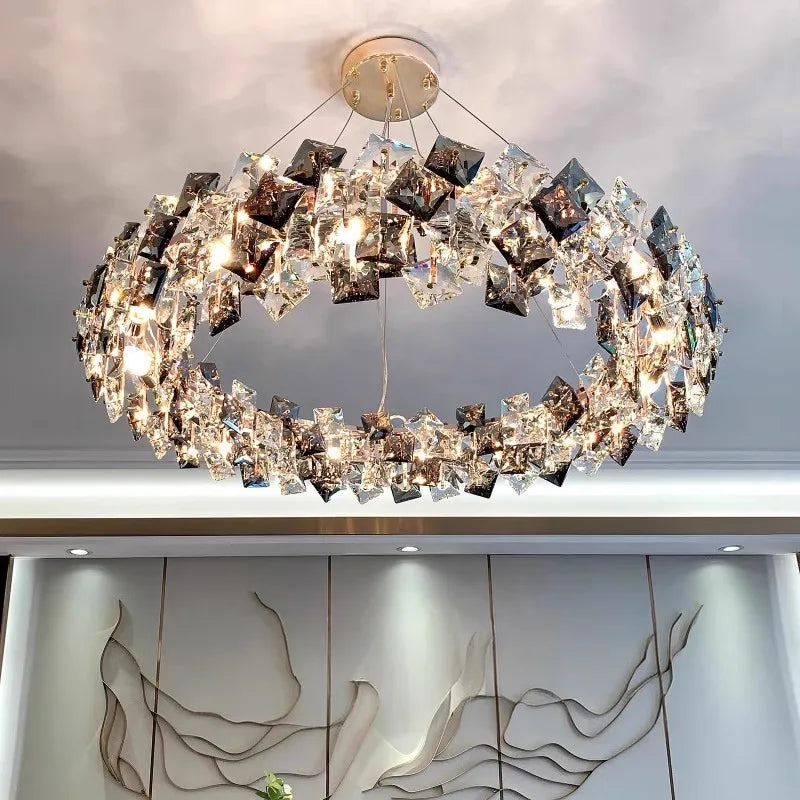 Elegant modern stainless steel crystal LED chandelier with square crystal accents and warm ambient illumination.