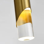 Sleek cylinder chandelier with gold and clear accents, warm white LED glow, modern elegance.