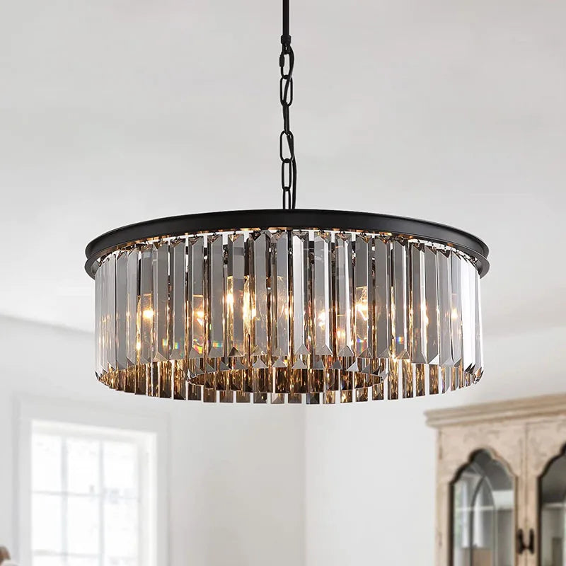 Round black metal chandelier with hanging rectangular crystal prisms and LED bulbs, suspended by chain.