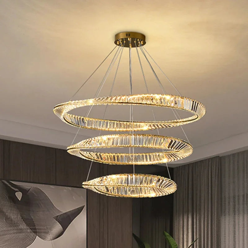 The Maison Ornate K9 Crystal Chandelier with three irregular LED rings suspended elegantly.