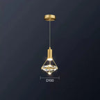 Ornate Nordic diamond crystal pendant with gold fixture and glass shade, warmly illuminated, elegant design.