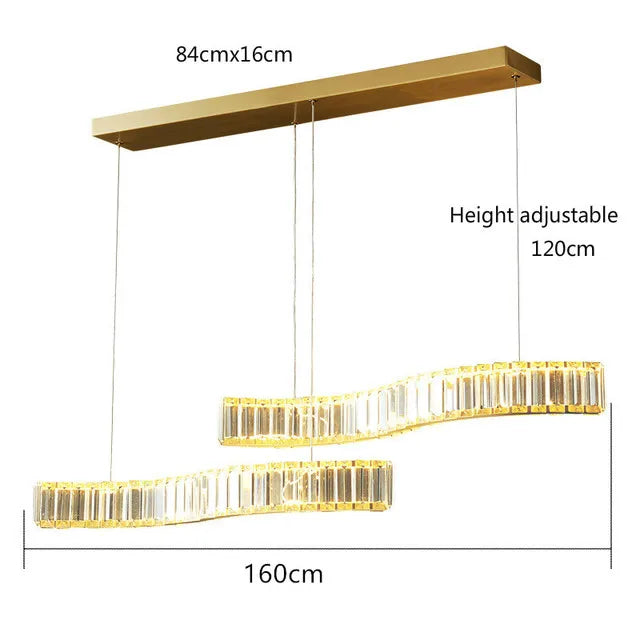 Two wavy crystal bars and stainless steel bands suspend from a gold ceiling plate chandelier.