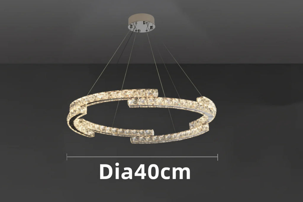 Maison Ornate Crystal Chandelier with dual offset rings, LED-lit, stainless steel, suspended design.