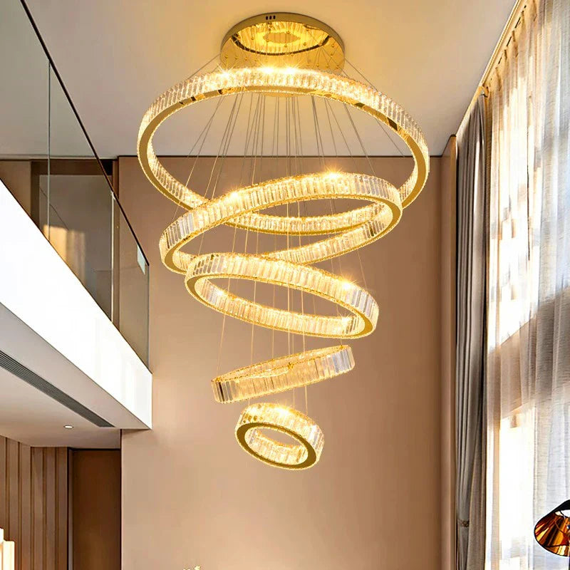 Maison Ornate Modern Crystal Chandelier with spiral gold rings and LED lights, luxurious contemporary design.