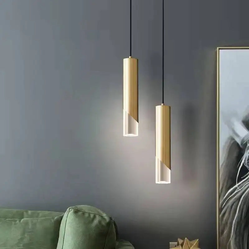Two Maison Ornate Crystal LED Cylinder Iron chandeliers with gold and clear sections hanging.