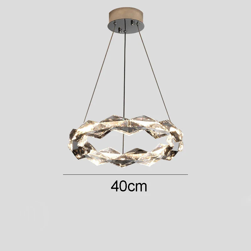 Twisted circular chandelier with integrated LED, metal suspension, and three-wire support, 40 cm diameter.