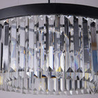 Close-up of Maison Ornate Nordic chandelier with black circular frame and vertical crystal prisms.
