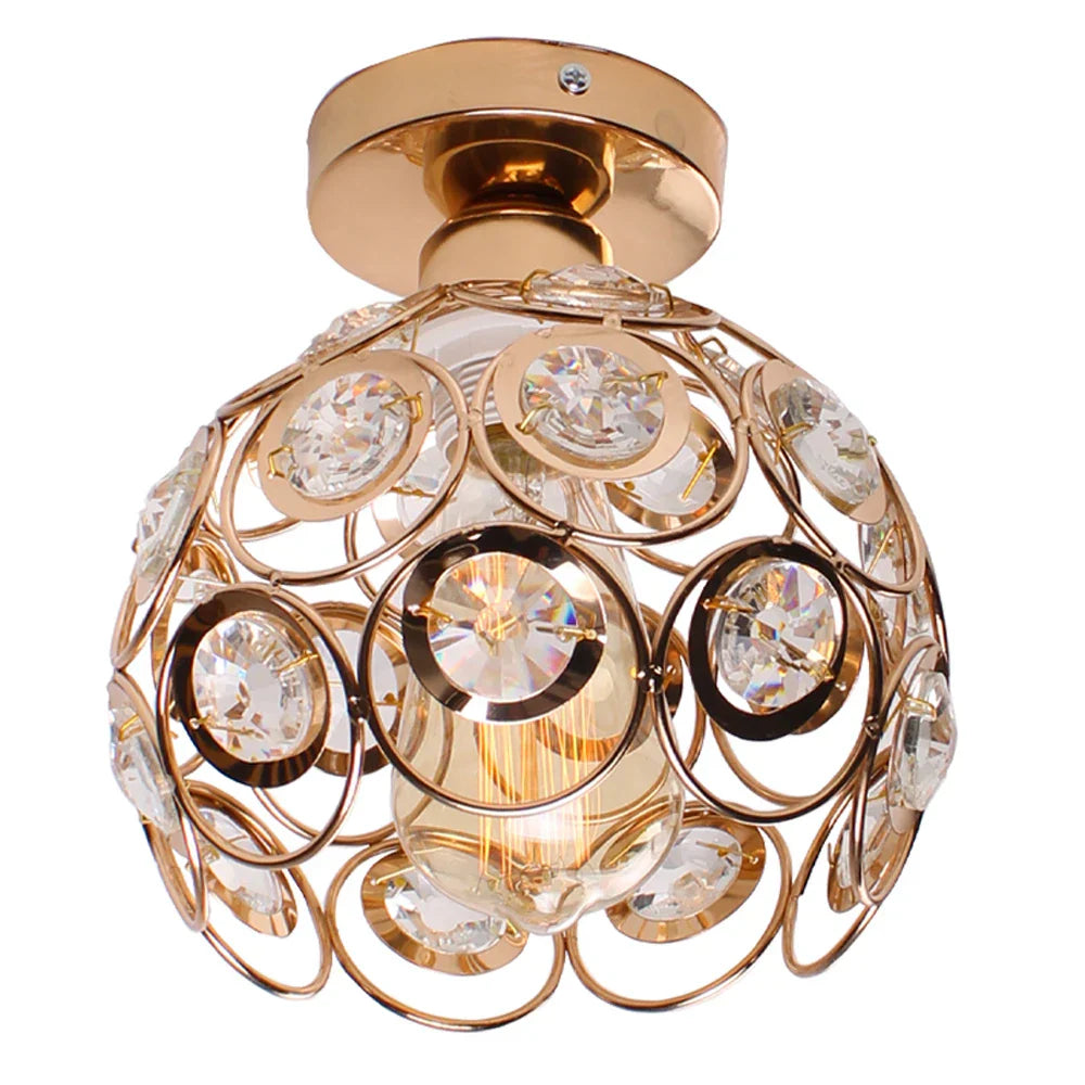 Gold sphere chandelier with circular accents, clear crystals, and visible bulb for elegant lighting.