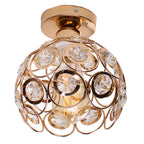 Gold sphere chandelier with circular accents, clear crystals, and visible bulb for elegant lighting.