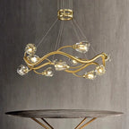 The Modern LED Crystal Pendant by Maison Ornate features a gold wavy frame and glass covers.
