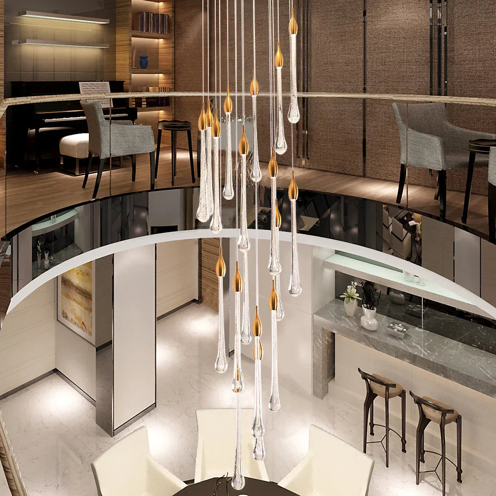 Maison Ornate Modern LED Crystal Chandelier with adjustable height and glass droplets, designed for large stairways.