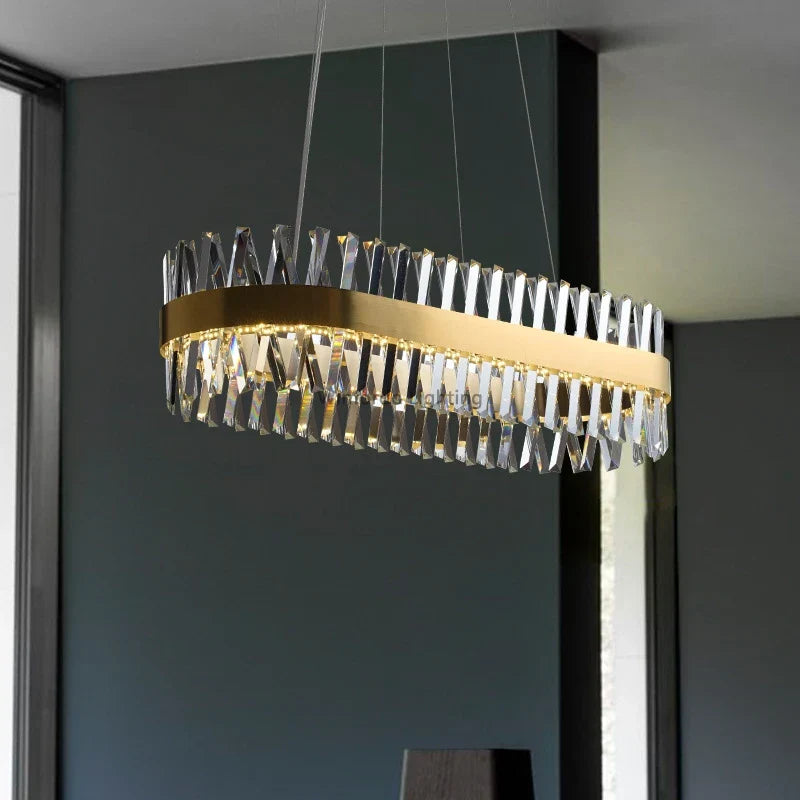 Maison Ornate Crystal Chandelier features gold finish, vertical prisms, slim wires; elegant indoor lighting.