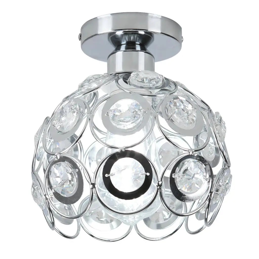 Spherical chandelier with chrome finish and clear crystal accents, ideal for modern hallway lighting.