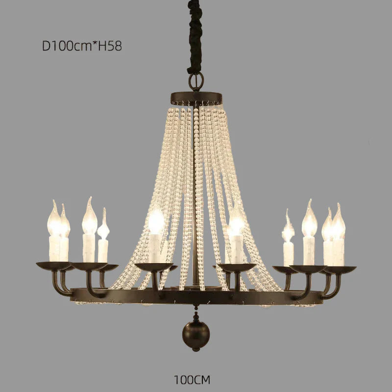Elegant gold crystal chandelier with tassels, ten candle bulbs, and draped crystal strands.