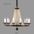 Elegant gold crystal chandelier with tassels, ten candle bulbs, and draped crystal strands.