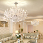 Maison Ornate Large Crystal Chandelier with cascading crystals and gold trim, radiating elegant, soft illumination.