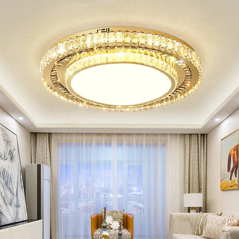 Maison Ornate Round Crystal Glass LED Modern Chandelier suspended from ceiling, intricate crystal detailing shines.