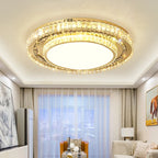 Maison Ornate Round Crystal Glass LED Modern Chandelier suspended from ceiling, intricate crystal detailing shines.