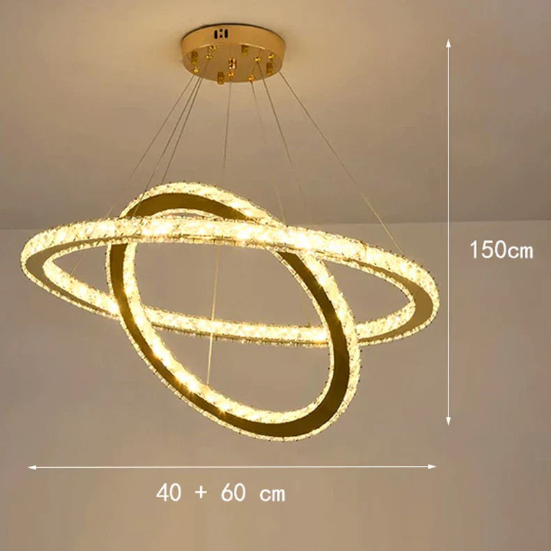 Gold LED chandelier with three intersecting crystal rings, dimmable, suspended and modern; 150cm high.